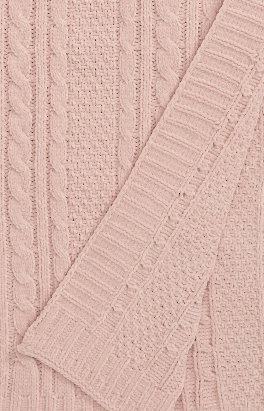 Close-up of the soft knit pink blanket