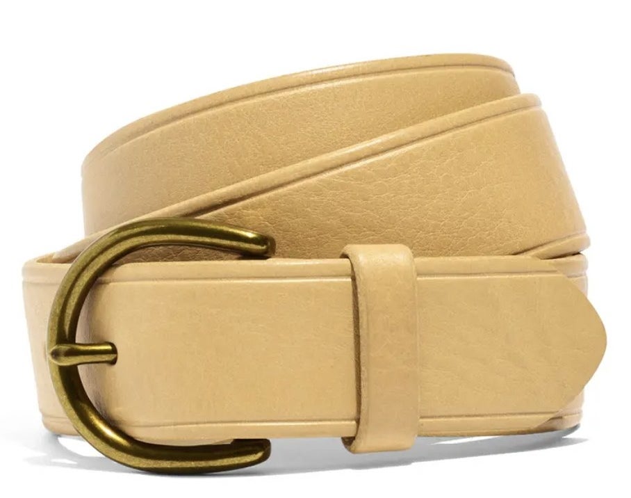 The cream curvy buckle belt rolled up
