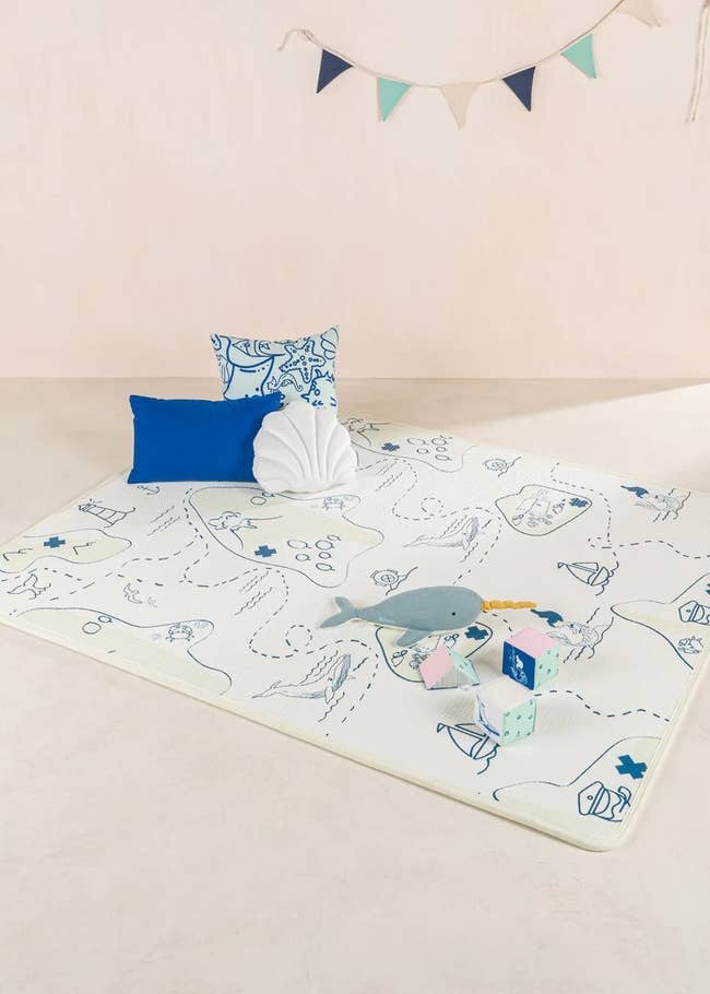 ocean map play mat with toys on top