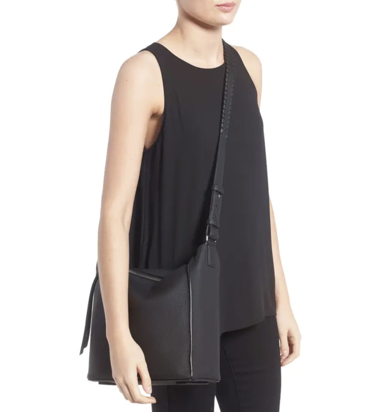 Model wearing the black purse crossbody
