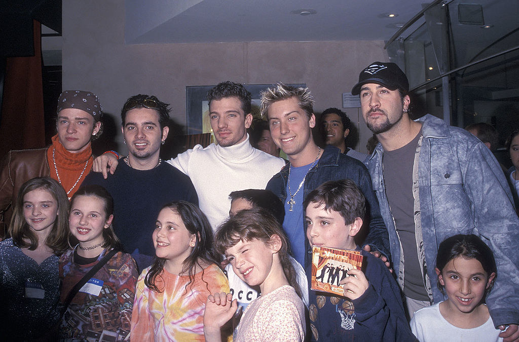 nsync taking photos with young fans