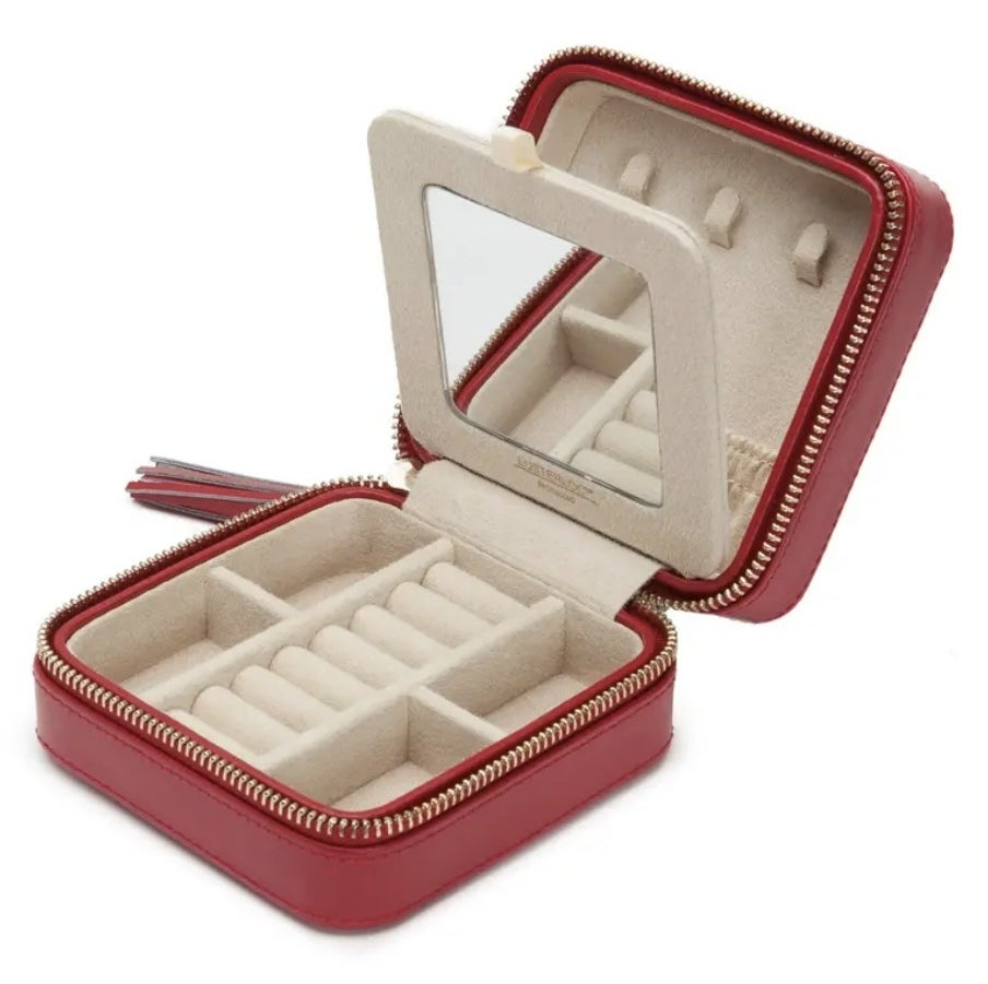 The red zippered jewelry case open to show mirror and different storage compartments