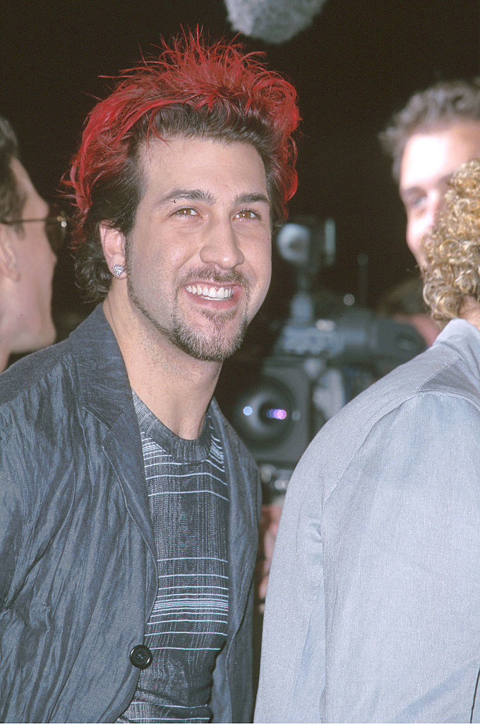 joey smiling with red tipped hair
