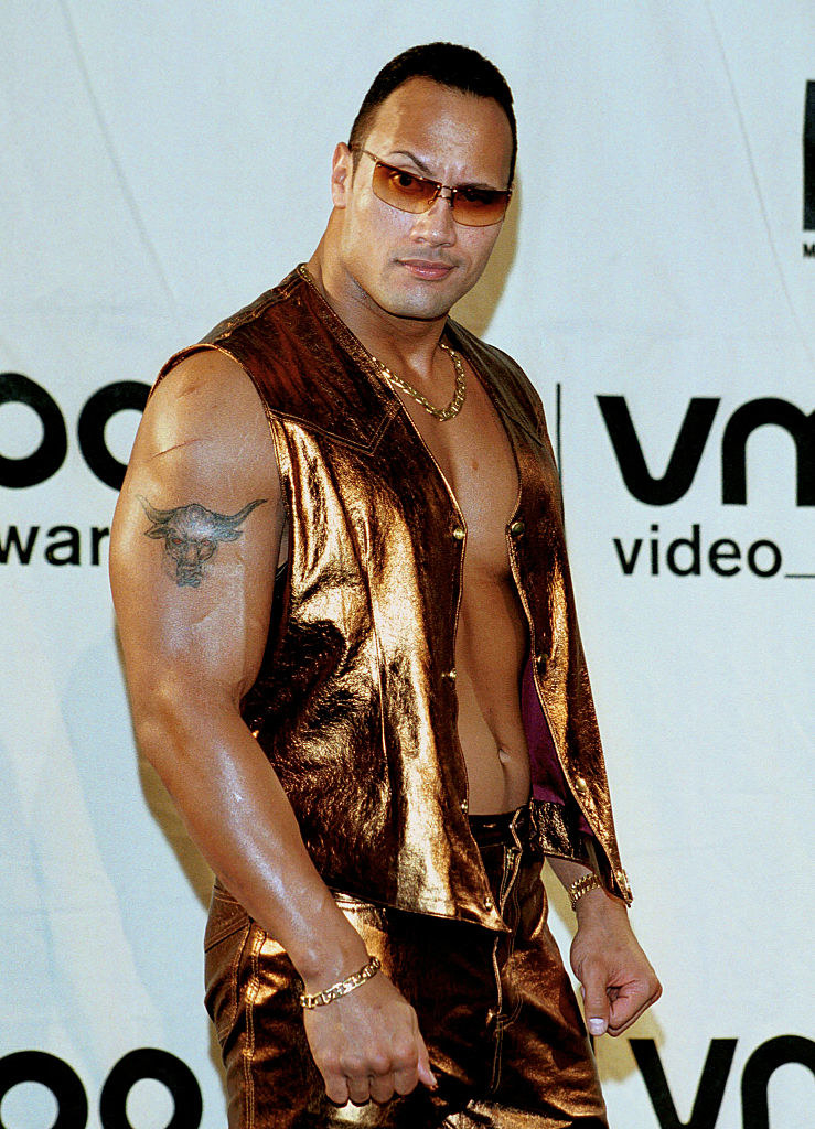 The Rock wearing a metallic outfit