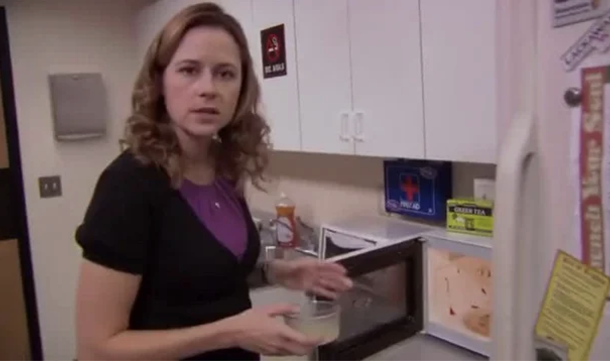 a character opening up a dirty microwave