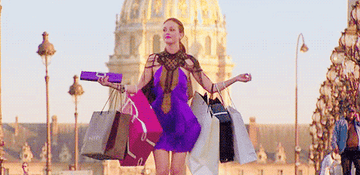 Blair from Gossip Girl walking with shopping bags