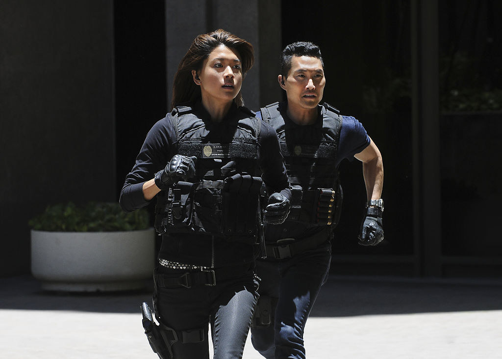 two two in police uniform running
