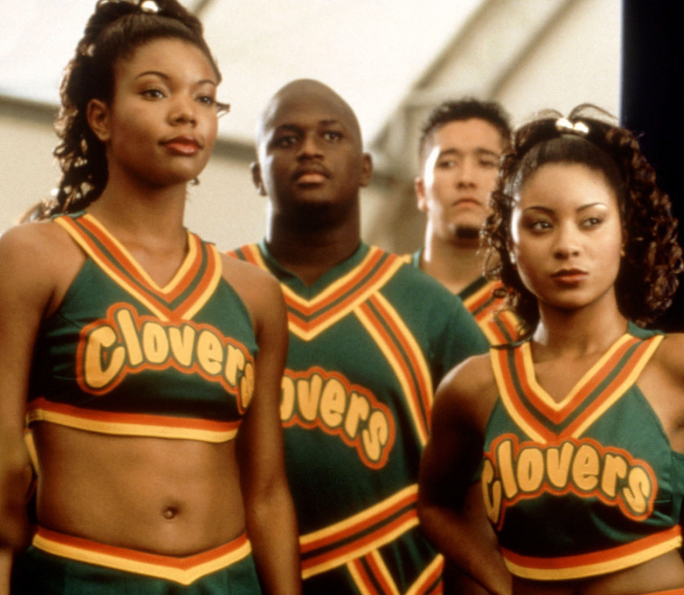 Gabrielle Union as Isis wears her Clovers cheerleading outfit next to fellow cheerleaders