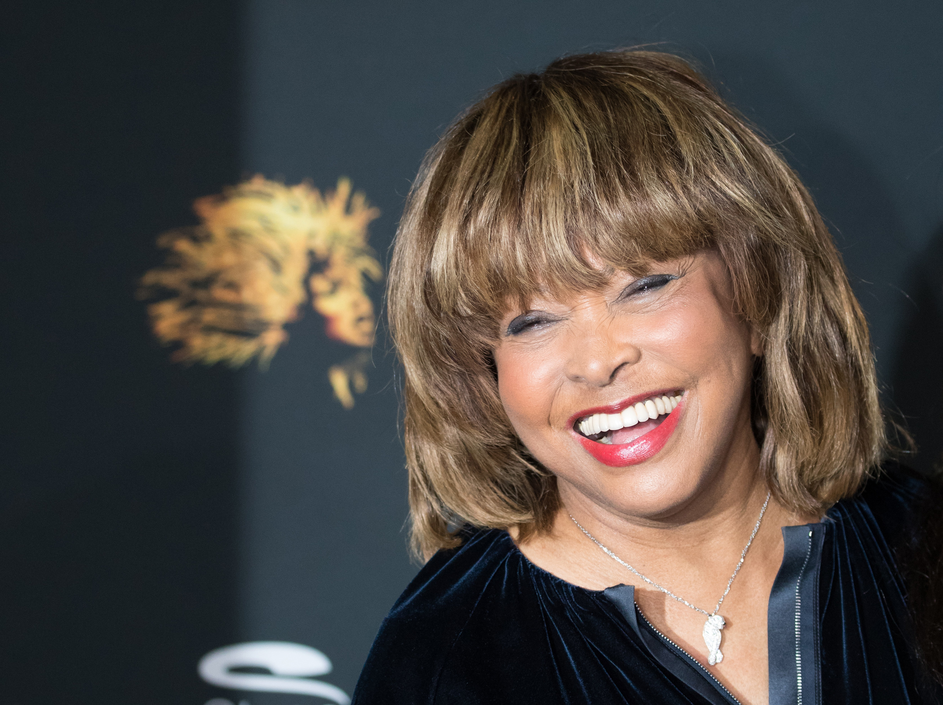 Tina Turner smiles while attending a photo shoot for &quot;Tina - The Tina Turner Musical&quot; in 2018