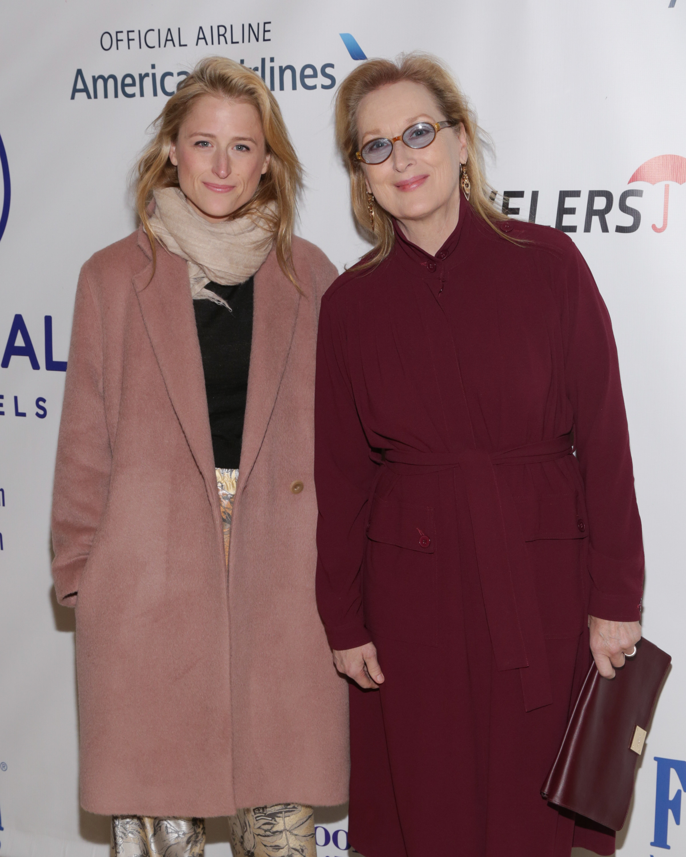 Mamie Gummer in a pink peacoat and Meryl Streep in a red coat dress attend the Citymeals-On-Wheels Power Lunch at The Plaza Hotel in November 2015