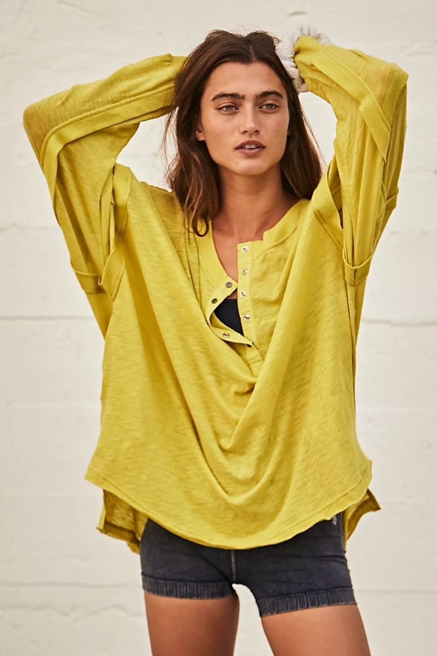 model wearing oversized yellow long sleeve