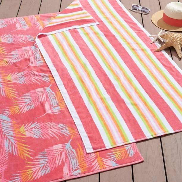 two beach towels laying on top of each other