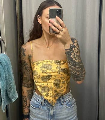 reviewer in the yellow bandana top with black pattern