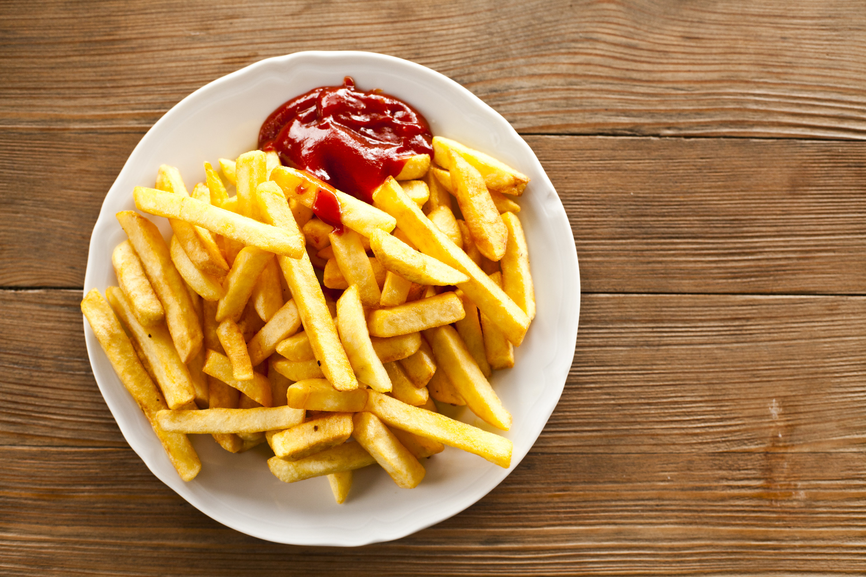 french fries and ketchup on a plate