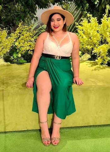 reviewer wearing the green skirt