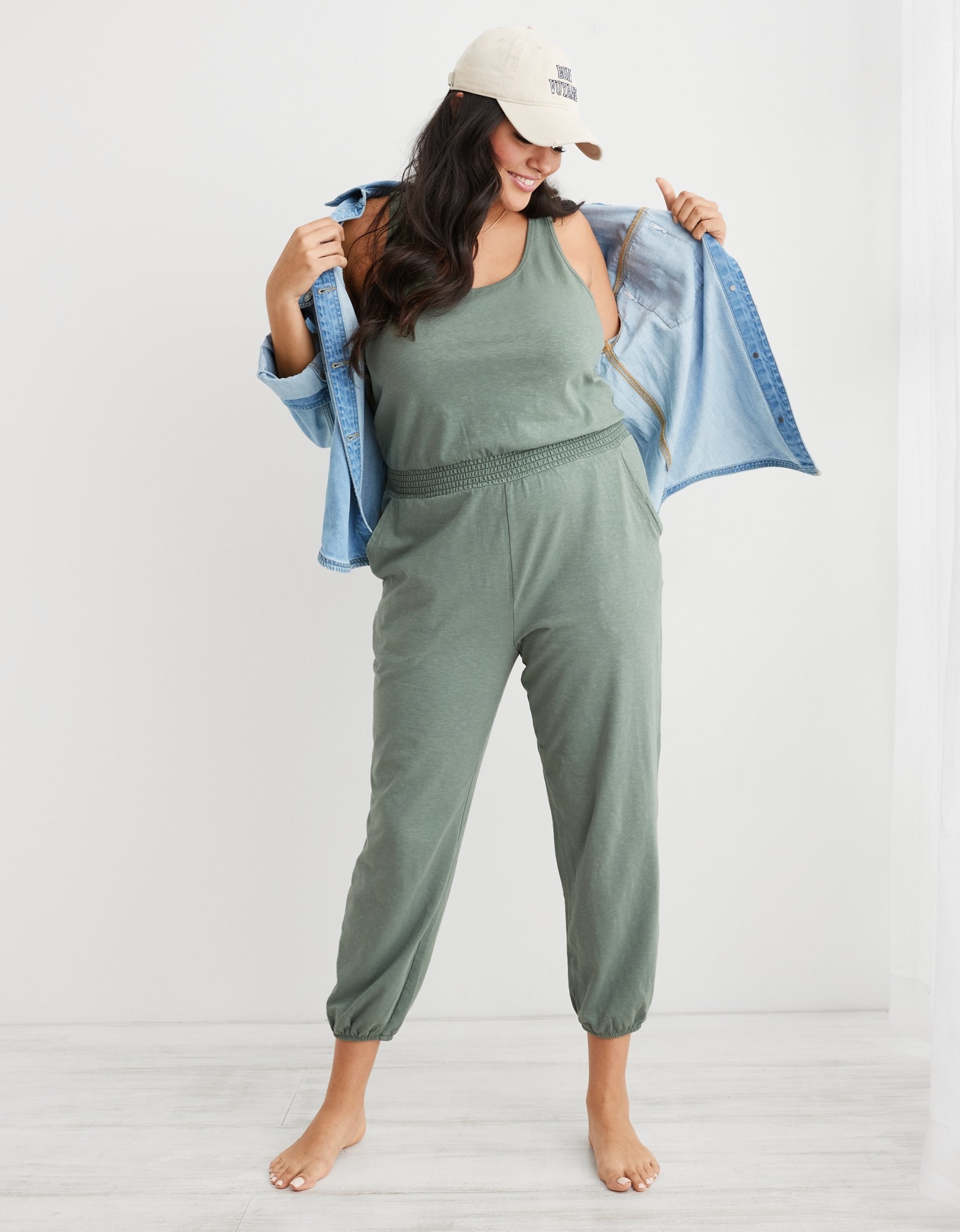 model in sage green tank pant jumpsuit with elastic waist