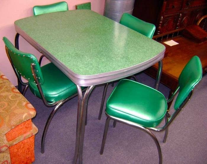 a green table with green chairs