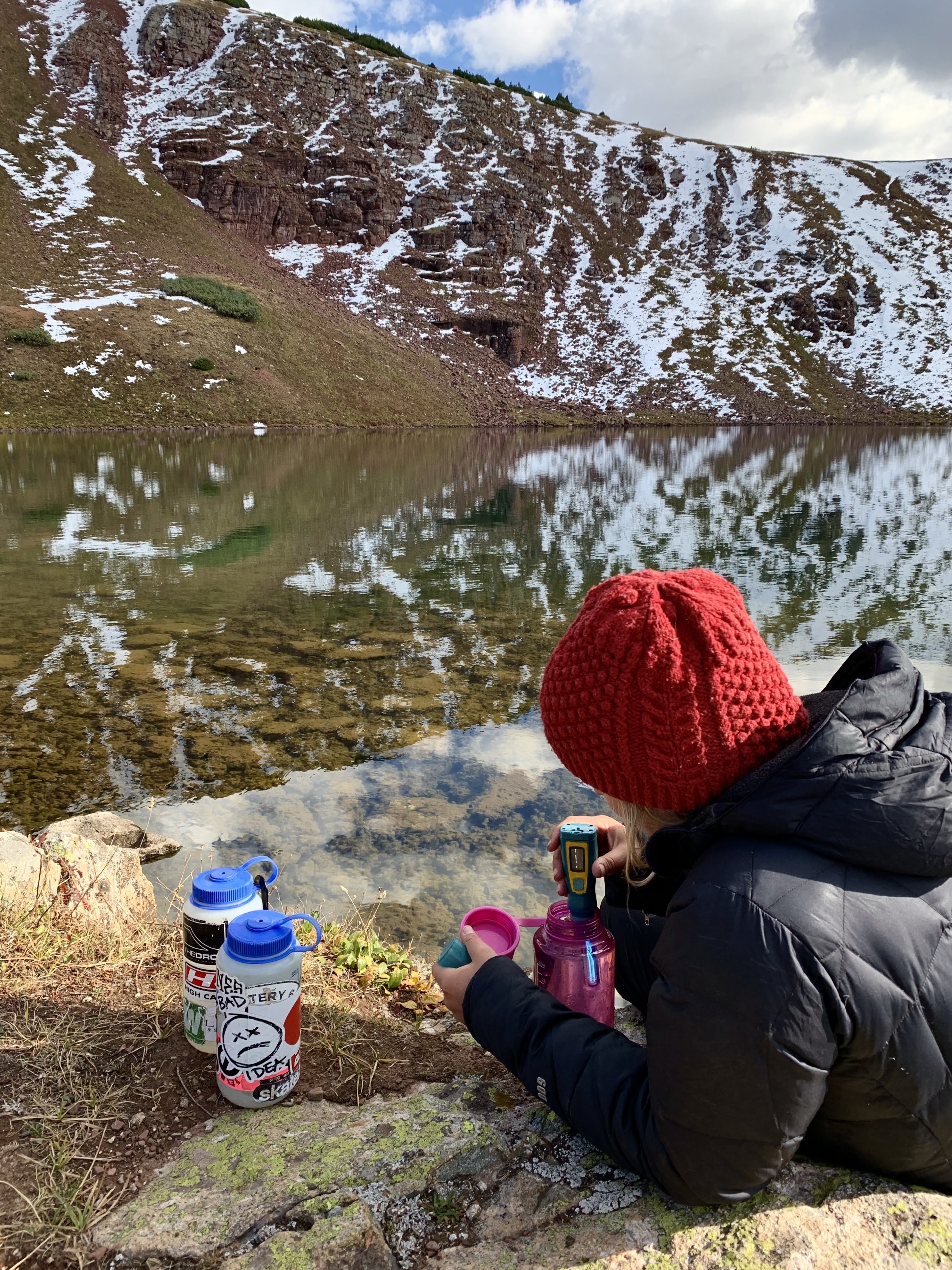 Woman cleaning water with a Steripen