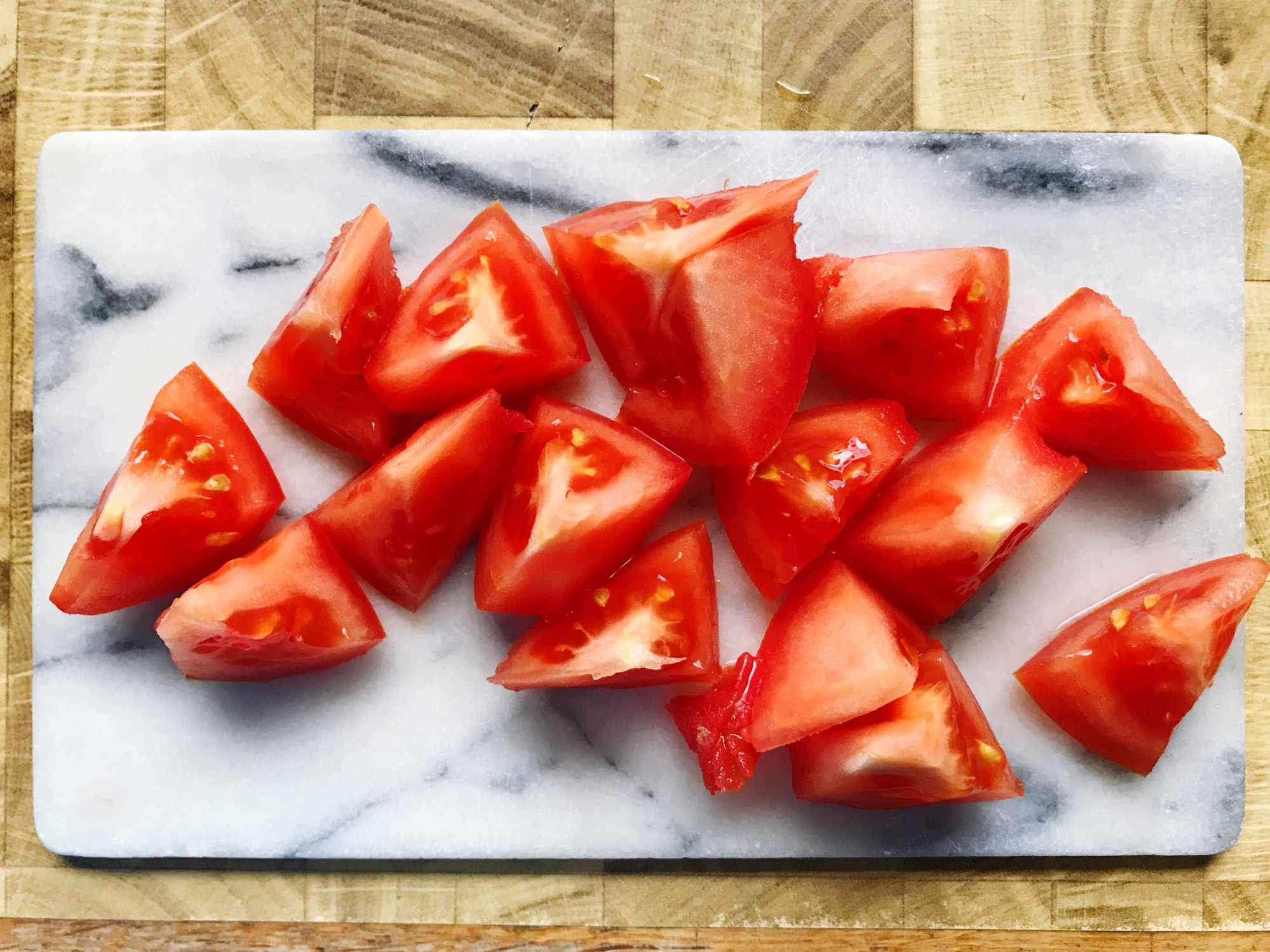 Sliced tomatoes on a cutting board