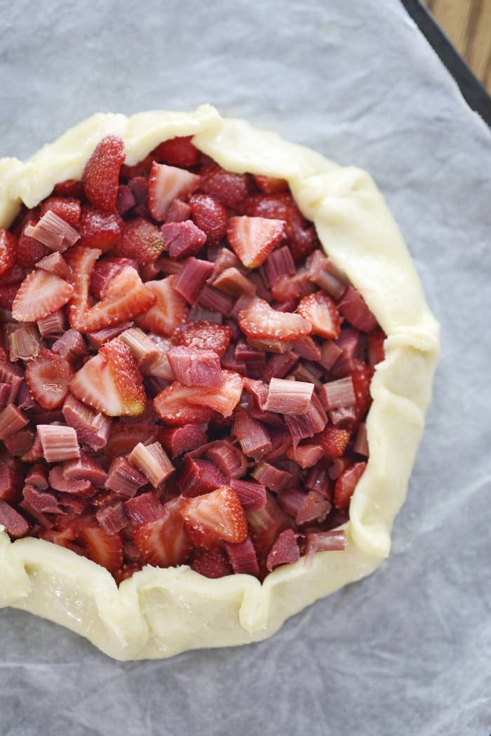 An unbaked strawberry rhubarb pie.