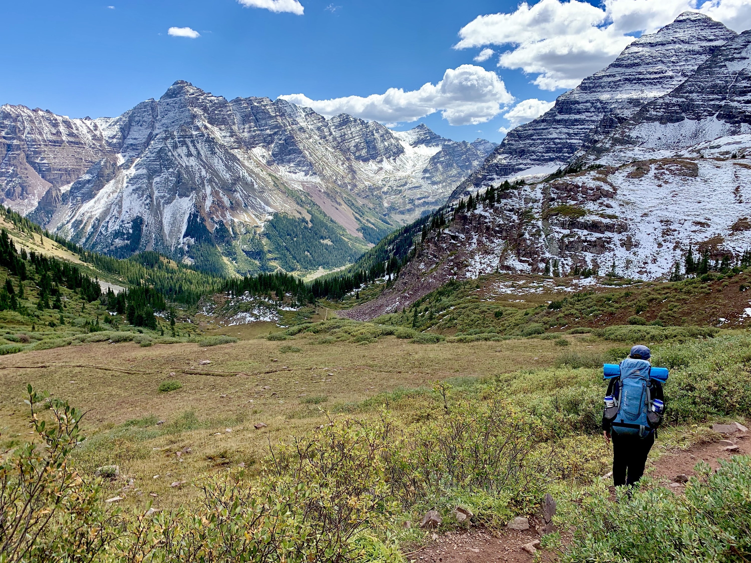 Woman on a hiking trail in the mountains