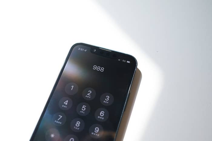 &quot;988&quot; is displayed on an iPhone screen