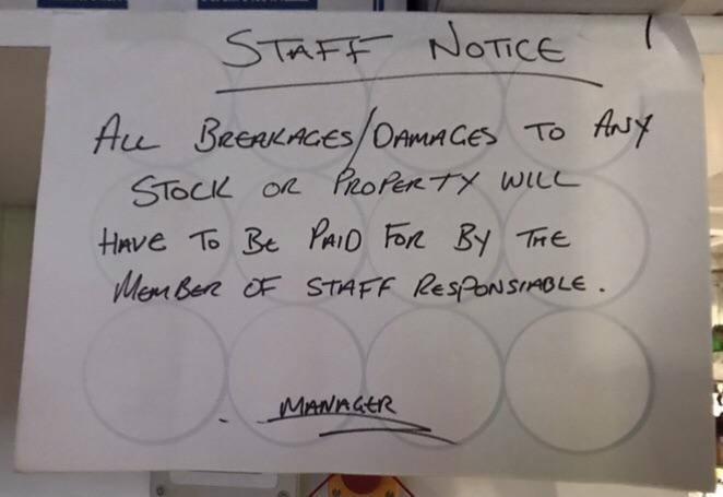 A notice telling staff they are responsible for paying for any broken items.
