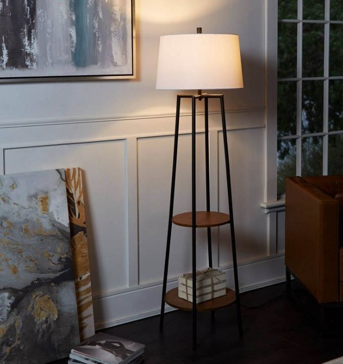 Floor lamp with shelves lit up at night