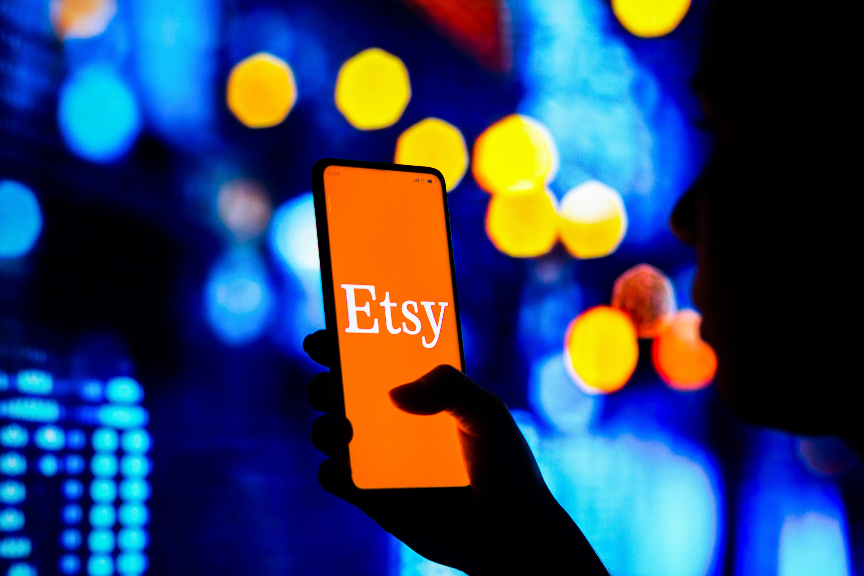 The Etsy logo on someones phone