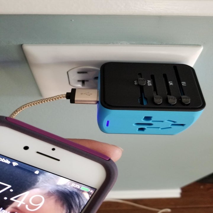 Reviewer image of phone plugged into adapter
