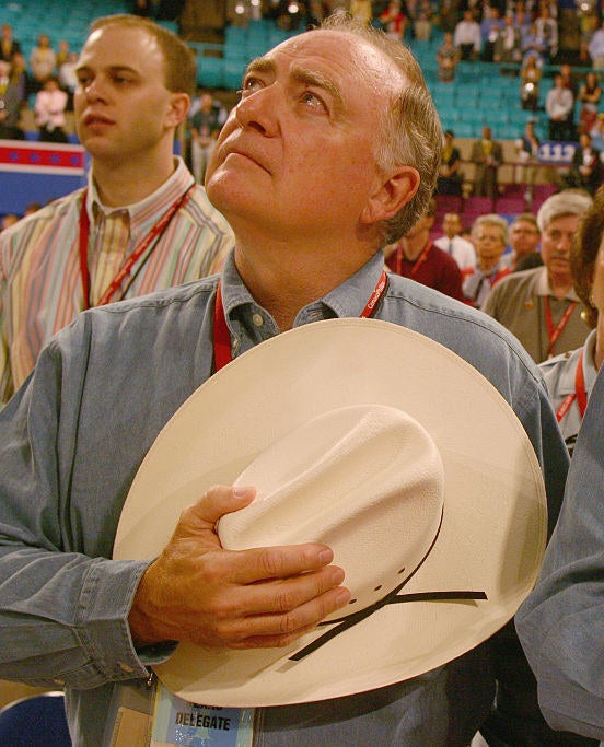 dan holding a cowboy hat