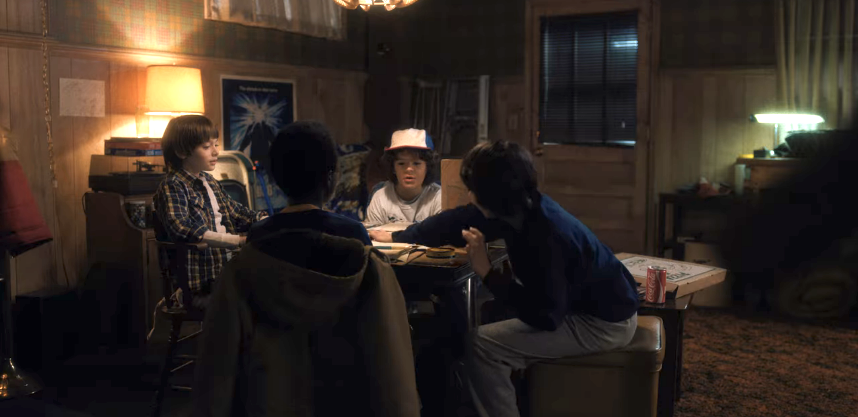 the kids sitting at a table