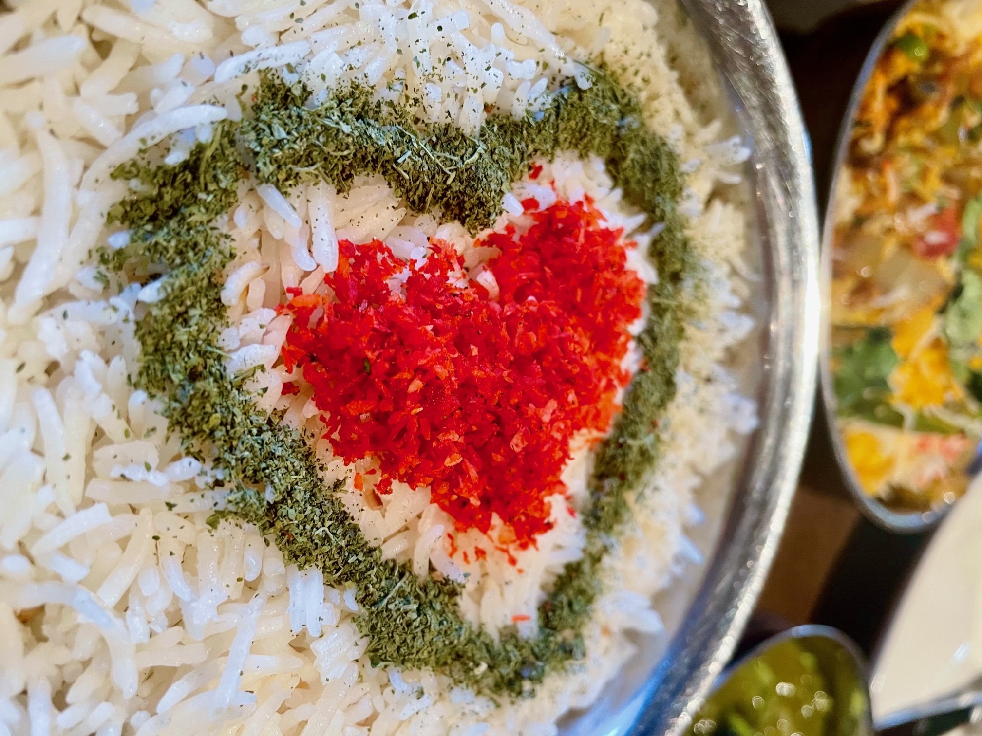rice with spices in a heart design