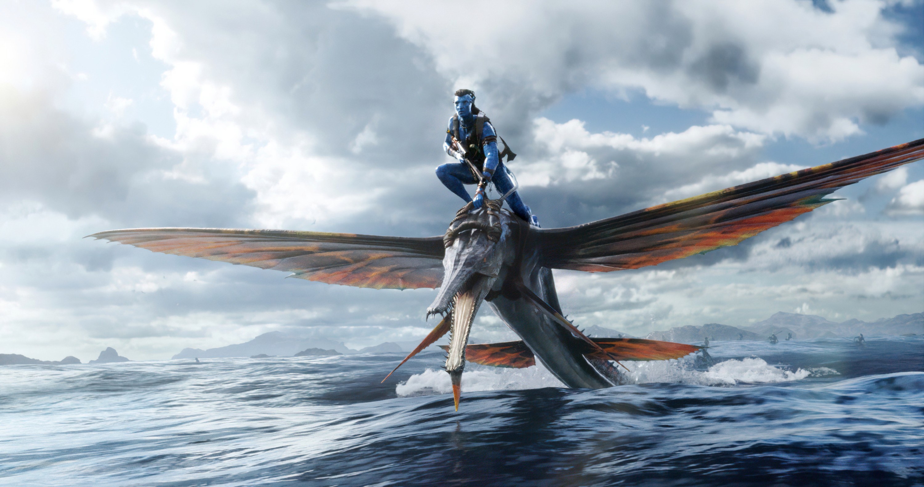 An avatar flies on a winged beast over water