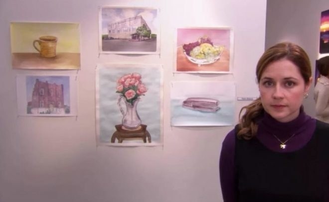 character standing in front of her art work