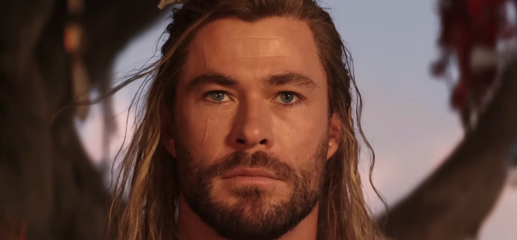 Thor sitting by a tree in &quot;Thor: Love and Thunder&quot;