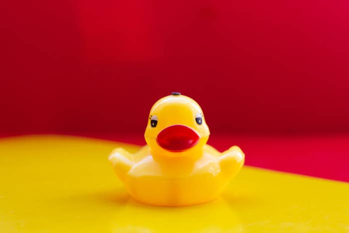 Yellow toy duck with red lips