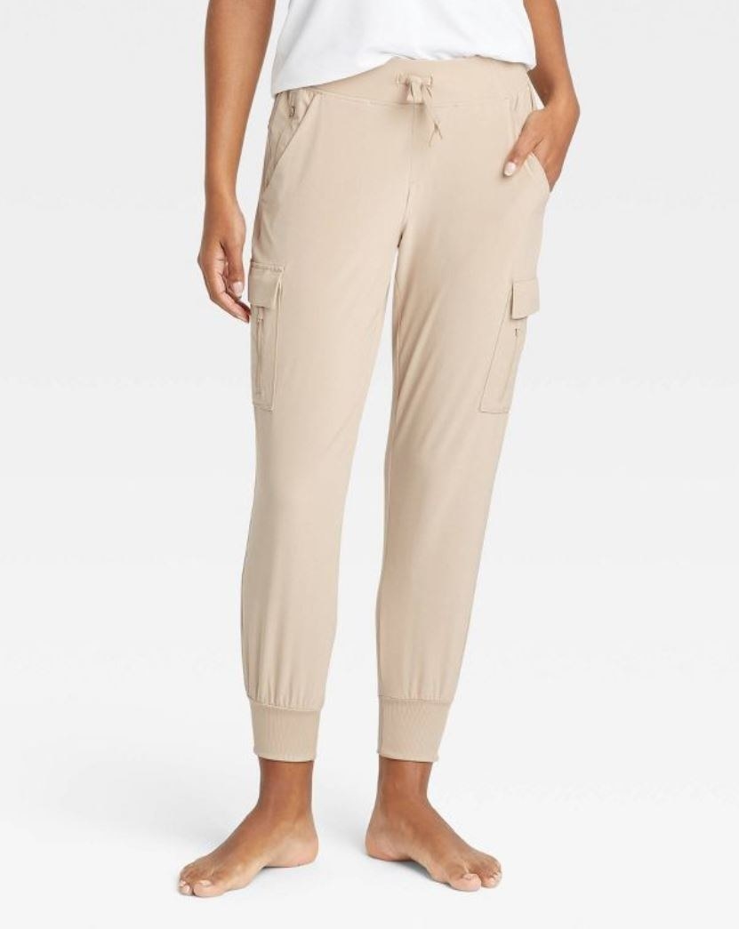 model wearing beige stretch woven cargo pants