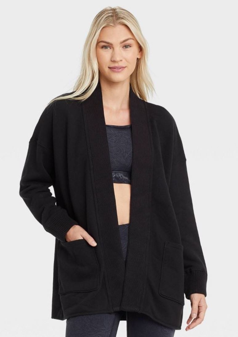 model wearing black french terry cardigan
