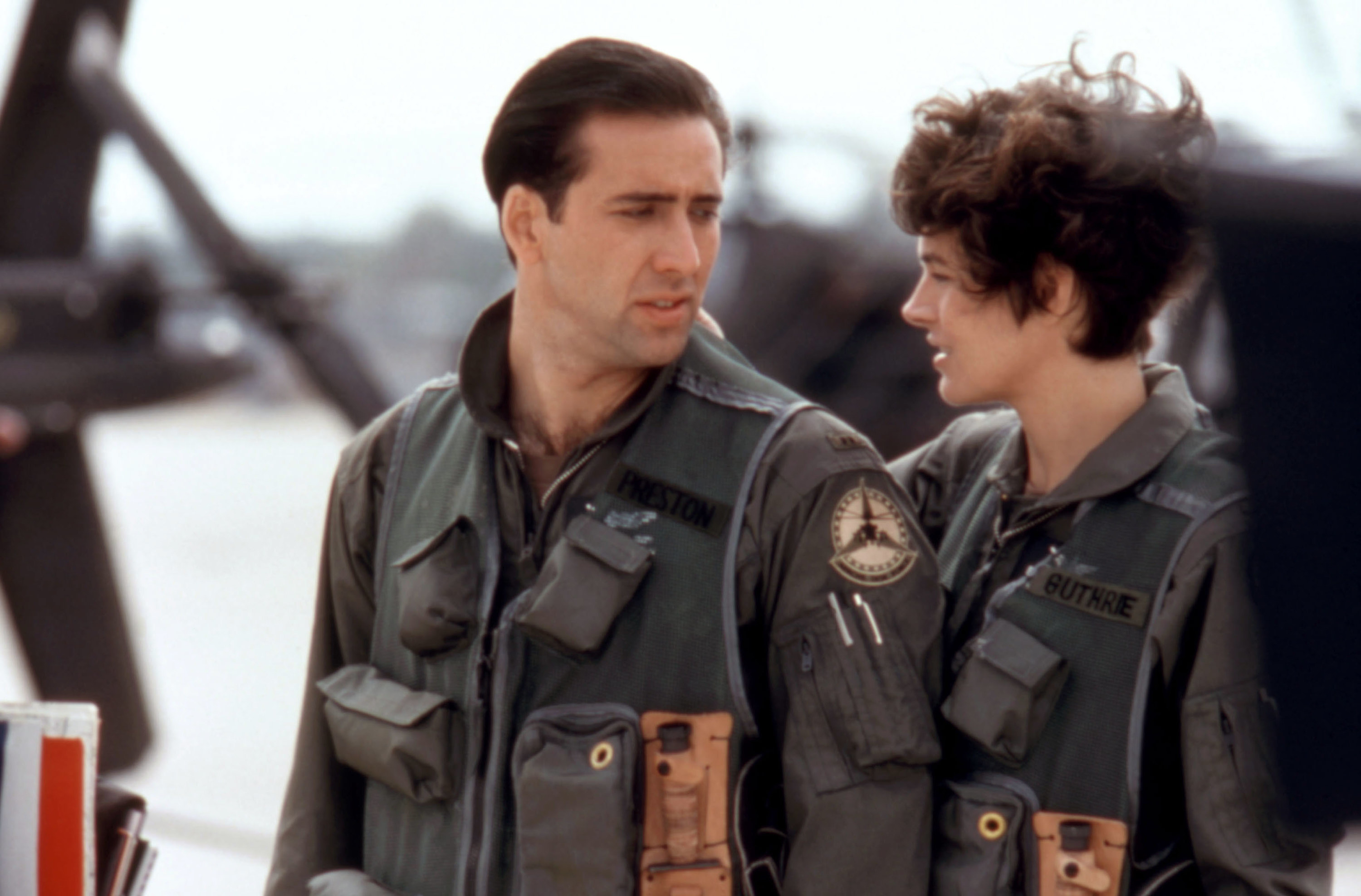 Nicolas Cage, Sean Young in pilot uniforms