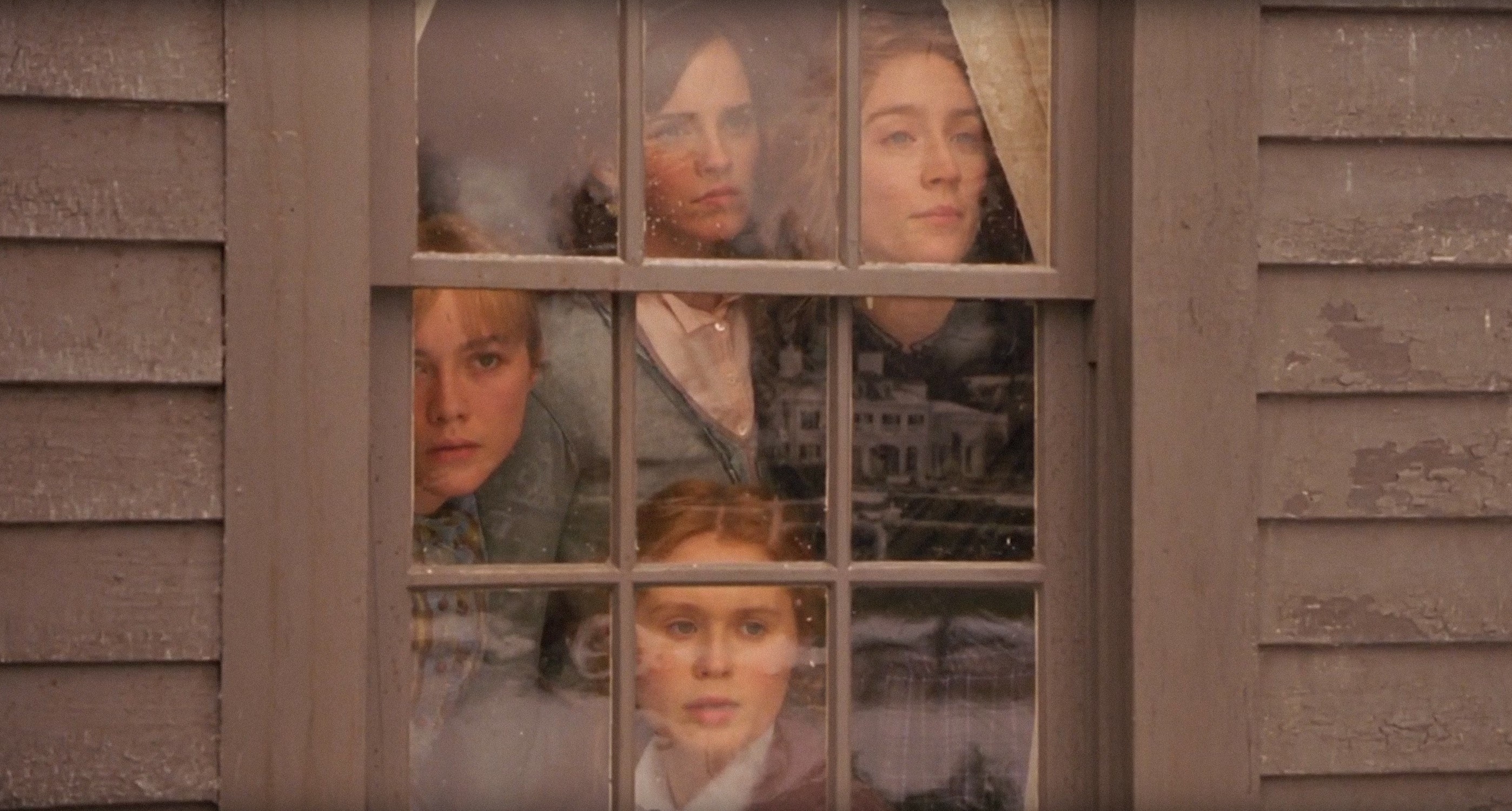 Emma Watson as Meg, Saoirse Ronan as Jo, Eliza Scanlen as Beth, Florence Pugh as Amy, looking out a window together