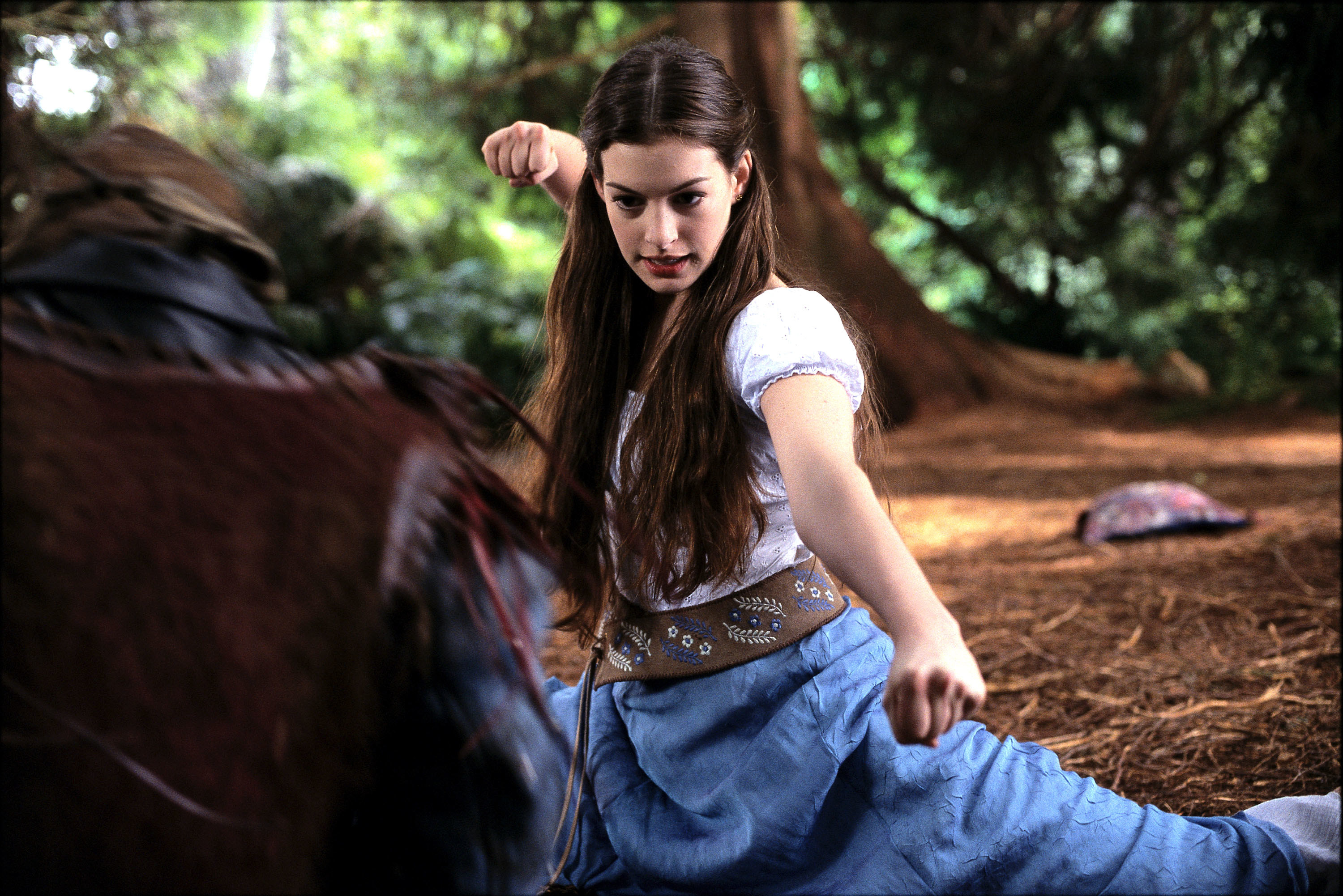 Anne Hathaway as a princess in fighting stance