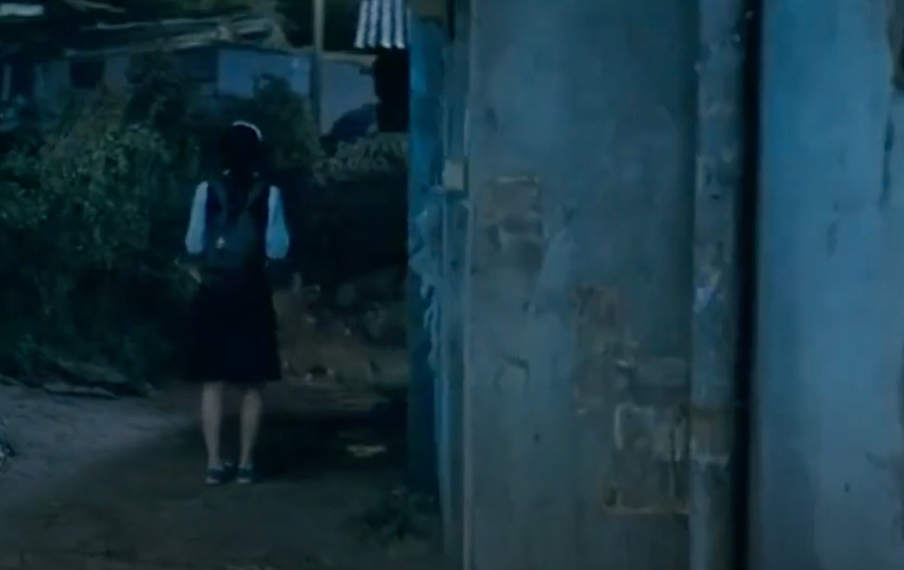 Girl is walking down a dark alleyway in Mother film