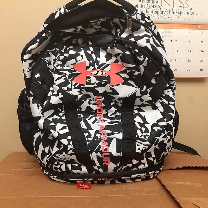 Reviewer's photo of the white and black abstract print backpack
