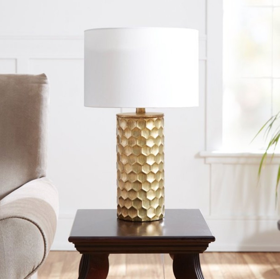 A gold table lamp