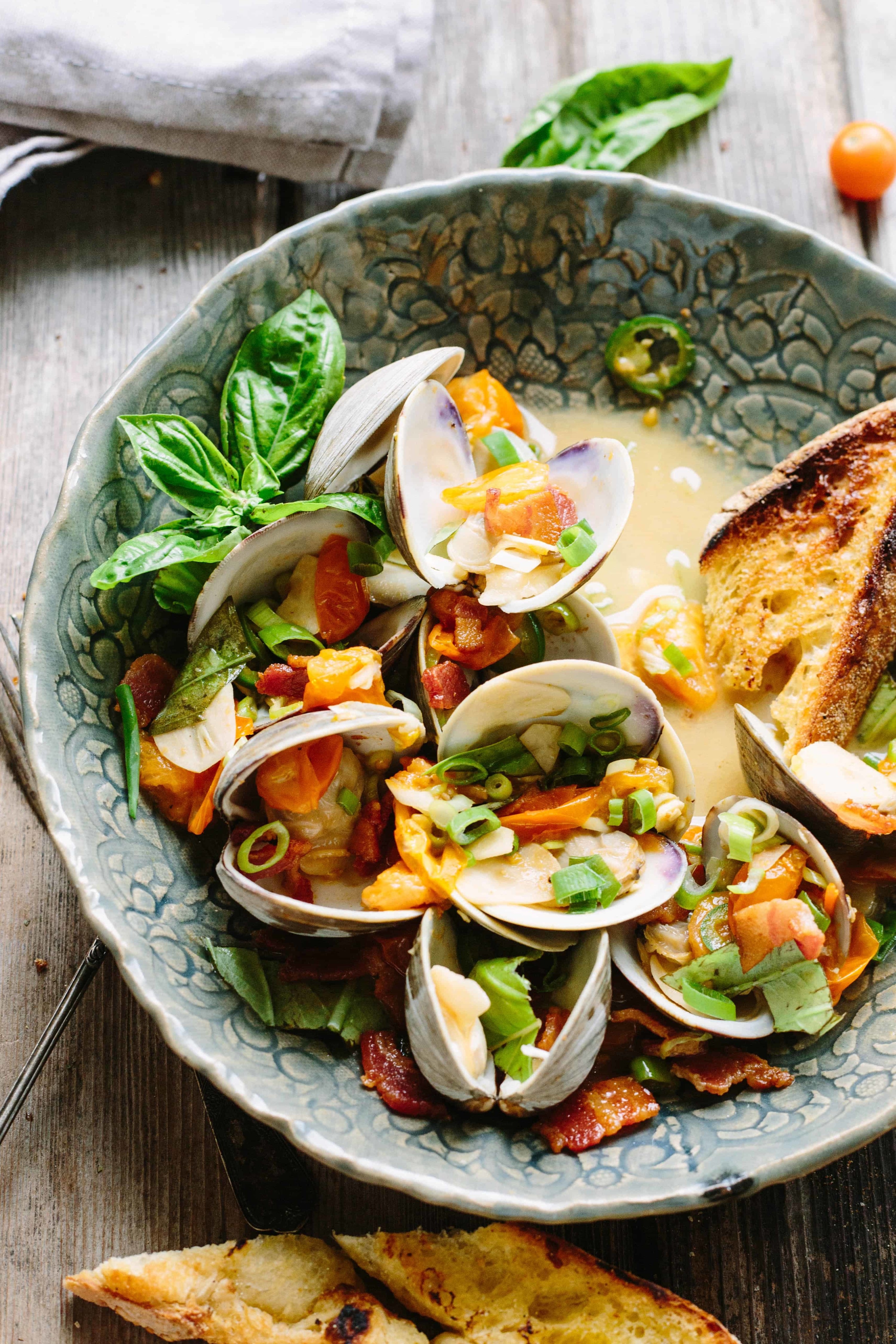 Brothy clams with bread.