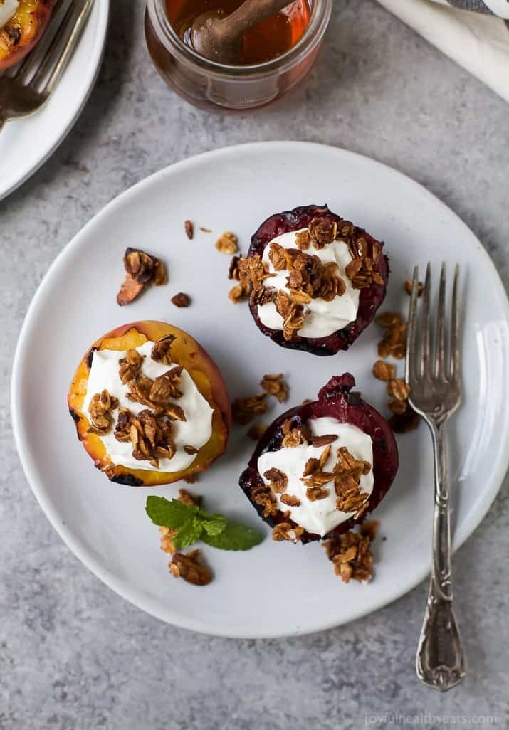 Grilled peaches and plums with yogurt and granola