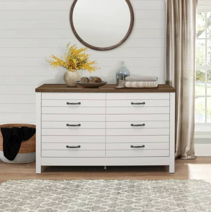An off white 6 drawer dresser