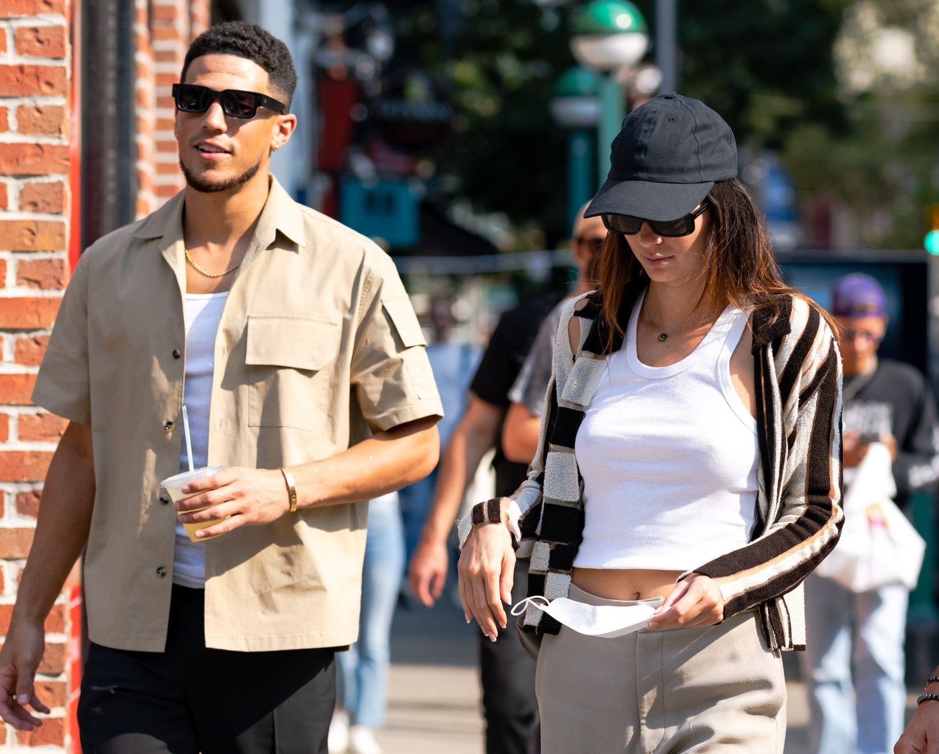 A close-up of Kendall and Devin outside walking together