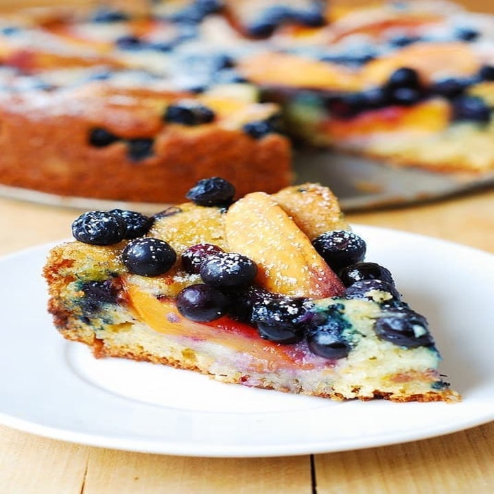 A slice of peach and blueberry cake.